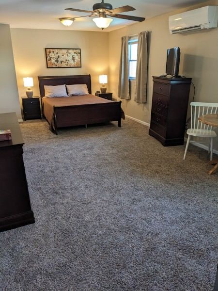 Room 1, a queen bedroom with private adjacent bath.